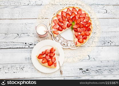 Traditional homemade strawberry cake on wooden background. Homemade Strawberry cake