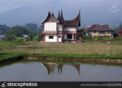 Traditional house nbar pond, Sumatra, Indonesia