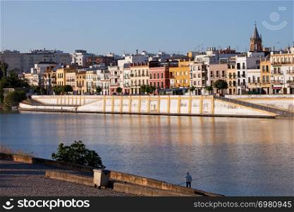 Traditional houses along the Guadalquivir river in the city of Seville, Andalusia, Spain.