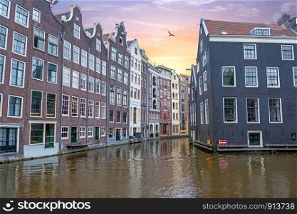 Traditional houses in Amsterdam in the Netherlands at sunset
