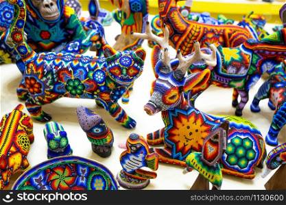 Traditional huichol bead ornament figures mexican culture work. Traditional huichol bead ornament figures mexican culture