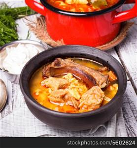Traditional hungarian dish - bogracs goulash, stewed meat and vegetables in cauldron