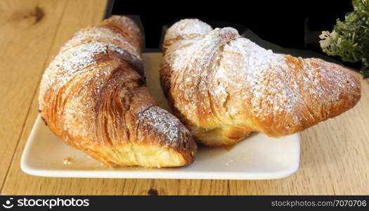 Traditional Italian breakfast, Italian brioches on white plate