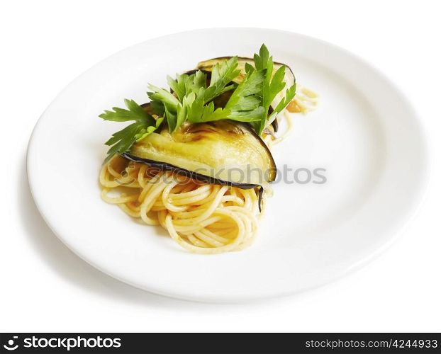 Traditional Italian cuisine. Close-up of spaghetti roll with aubergine, fresh tomatos and parsley. On white background.
