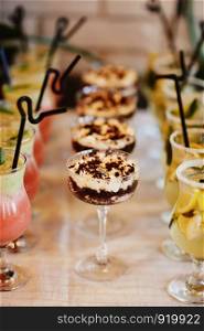 Traditional Italian dessert tiramisu in a glass. wedding dessert for the holidays. Traditional Italian dessert tiramisu in a glass. wedding dessert for the holidays.