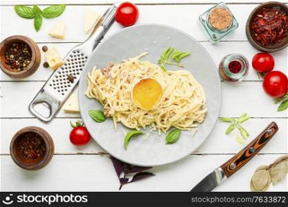 Traditional italian dish spaghetti carbonara with bacon.Dish of spaghetti alla carbonara. Spaghetti carbonara with bacon