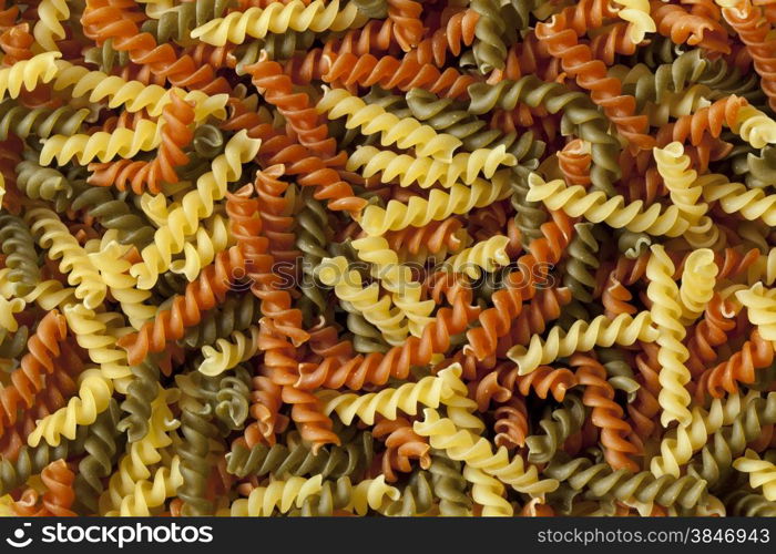 Traditional Italian fusilli tricocolore close up full frame