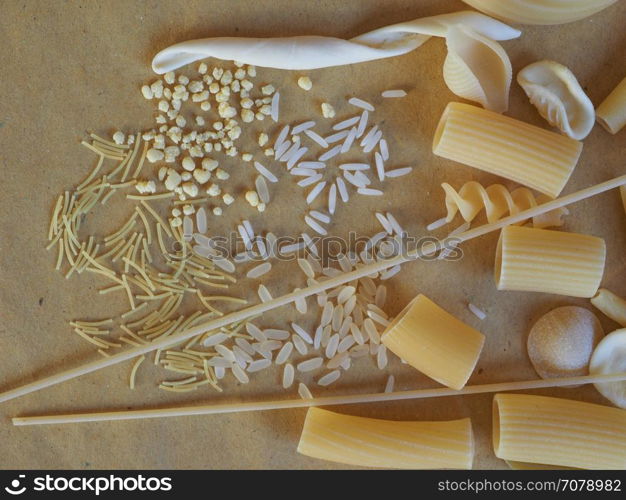 Traditional Italian pasta. Many different kinds of Italian pasta including penne macaroni (maccheroni) fusilli spaghetti trenette (linguine) orecchiette tortiglioni conchiglie (shells) rice and egg pasta