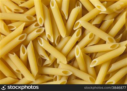 Traditional Italian penne rigate close up full frame