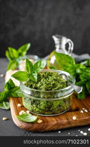 Traditional italian pesto alla genovese with fresh basil leaves, pine nuts, olive oil, garlic and parmesan cheese