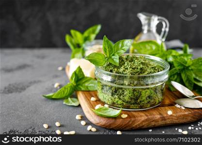 Traditional italian pesto alla genovese with fresh basil leaves, pine nuts, olive oil, garlic and parmesan cheese