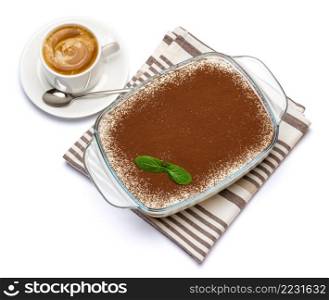 Traditional Italian Tiramisu dessert in glass baking dish and cup of fresh espresso coffee isolated on white background with clipping path embedded. Traditional Italian Tiramisu dessert in glass baking dish and cup of fresh espresso coffee isolated on white background with clipping path