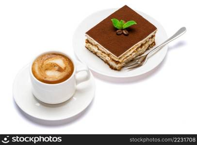 Traditional Italian Tiramisu dessert square portion on ceramic plate and cup of fresh espresso coffee isolated on white background with clipping path embedded. Traditional Italian Tiramisu dessert square portion on ceramic plate and cup of fresh espresso coffee isolated on white background with clipping path