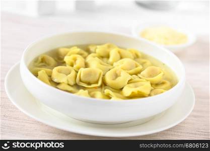 Traditional Italian Tortellini in Brodo (broth) soup, photographed with natural light (Selective Focus, Focus in the middle of the image)