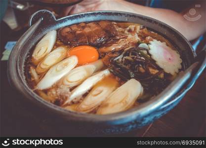traditional japanese sukiyaki meal hot pot. Close-up view. traditional japanese sukiyaki meal