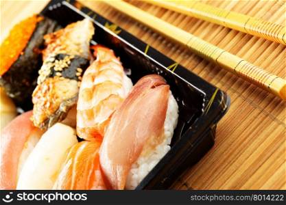 Traditional japanese sushi close-up and chopsticks
