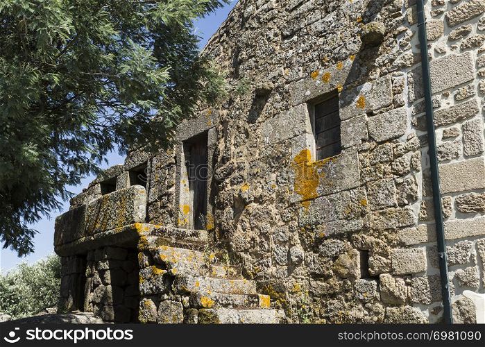 Traditional local granite house of the rural architecture of the Beira Alta region in Portugal
