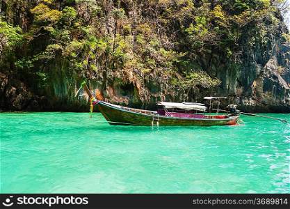 Traditional longtail boats in the famous Maya bay of Phi-phi Leh island, Thailand