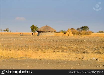 Traditional massai hut made . Traditional massai hut made of earth and wood in a rural village of Tanzania