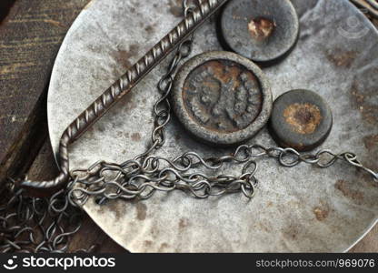 traditional metal scale weights and scale tray at a food market stall in Southeast Asia