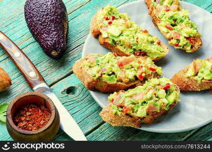Traditional mexican sauce guacamole and avocado sandwiches. Guacamole,mexican avocado appetizer