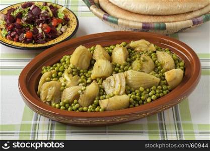 Traditional Moroccan tagine with meat, peas, fennel , beet salad and bread