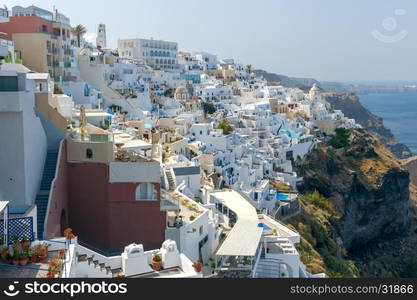 Traditional narrow street down to the sea in the village Fira. Santorini, Greece.