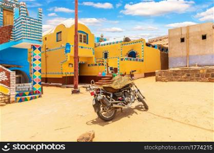 Traditional Nubian village in Africa and an authentic motorbike, Egypt.