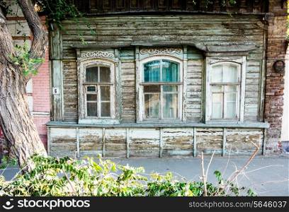 Traditional obsolete wooden cottage in a city. Astrakhan, Russia