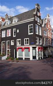 Traditional old Dutch style houses, corner of the Keizersgracht and Herenstraat in Amsterdam, Netherlands.
