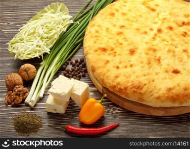 Traditional Ossetian feta cheese pie still life.