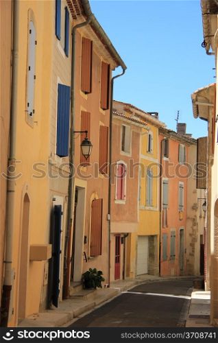 Traditional Provencal houses with plastered facades in bright colors