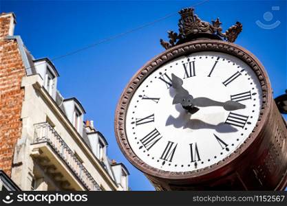 Traditional Public clock detail in Paris, France. Public clock detail in Paris