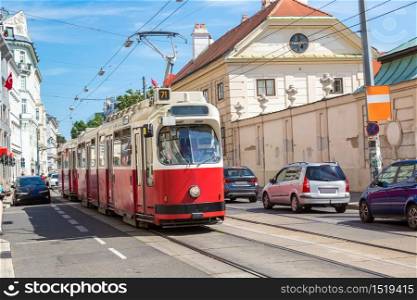 Traditional red electric tram in Vienna, Austria in a beautiful summer day
