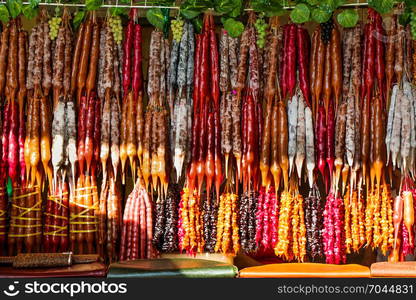 Traditional sausage-shaped candies with walnut in it