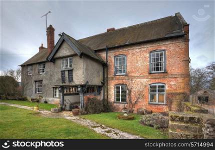 Traditional Shropshire farmhouse with original Tudor porch, England.