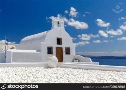 Traditional small white church in Oia on Santorini. Greece.. Oia. Greek church.