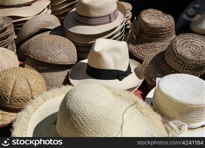 traditional straw hats at a market in the Provence