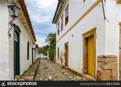Traditional street in the historic city of Paraty in the state of Rio de Janeiro with cobblestone pavement and colonial style houses. Traditional street in the historic city of Paraty 