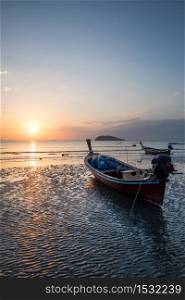Traditional thai boats at sunset beach, Krabi province,thailand