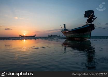 Traditional thai boats at sunset beach, Krabi province,thailand