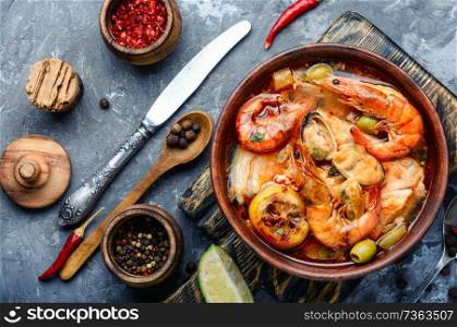 Traditional thai cuisine.Tom yum goong.Spicy shrimp soup.Ingredients for Thai soup. Spicy soup with seafood