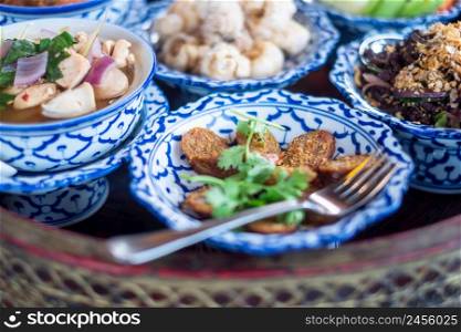 traditional Thai food on bamboo tray or Khan Toke, local food in Northern of Thailand