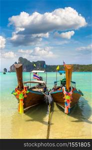 Traditional thai longtail boat at Log Dalum Beach on Phi Phi Don island, Thailand in a summer day