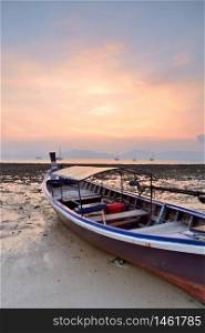 Traditional Thai Longtail Boat at Sunset