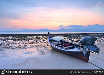 Traditional Thai Longtail Boat at Sunset