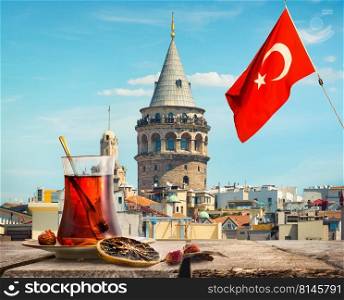 Traditional turkish apple tea on a background of cityscape