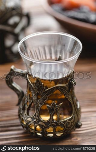 traditional turkish arabic tea glass one wooden desk