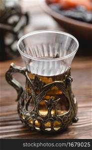 traditional turkish arabic tea glass one wooden desk