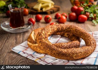 Traditional Turkish bagel with tea, cheese and tomato
